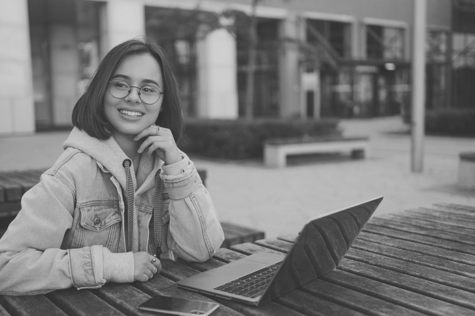 Person reviewing financial spreadsheet data on laptop