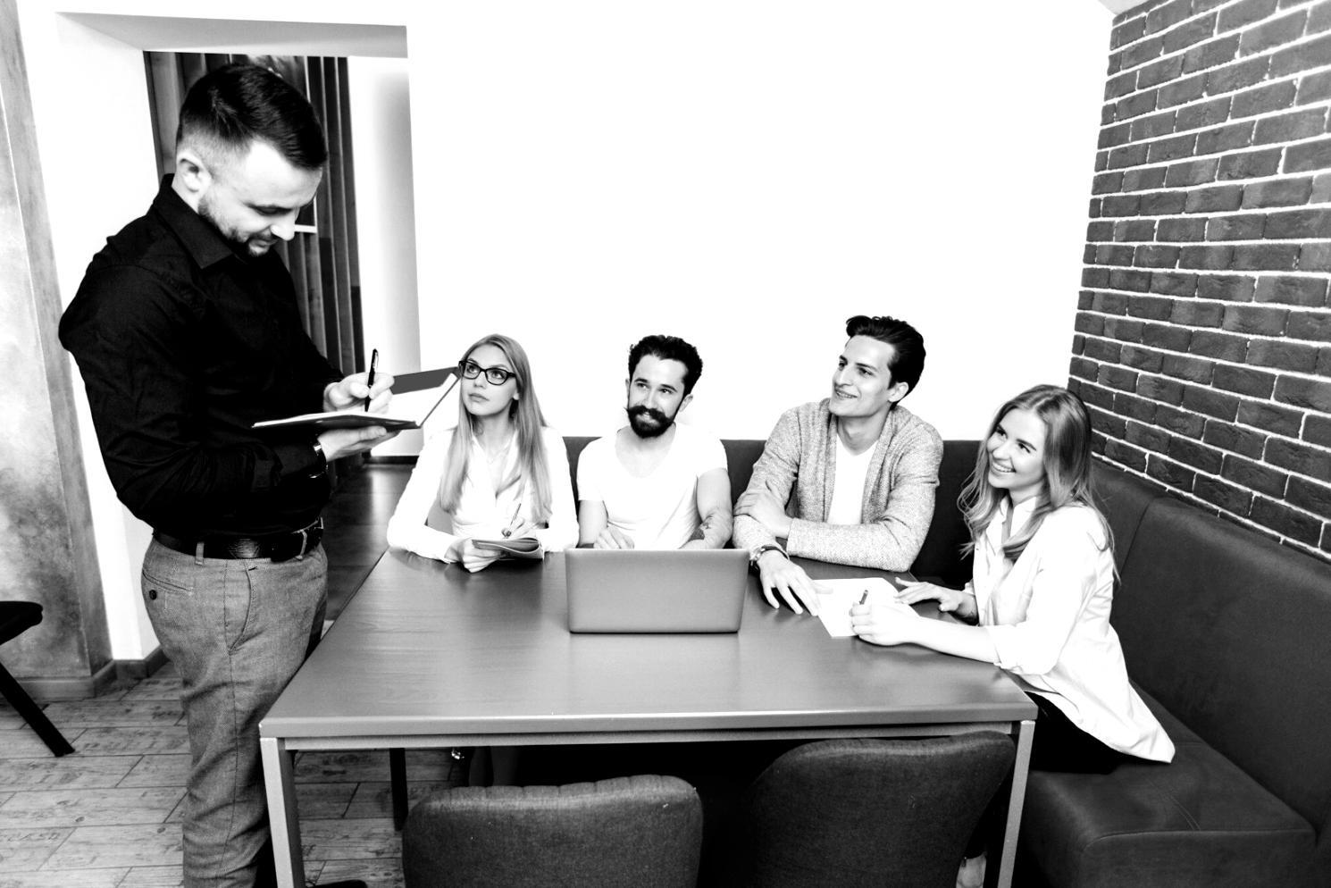 Student working on financial spreadsheet with mentor guidance